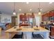 Island kitchen with stainless steel appliances and granite counters at 16140 W Almeria Rd, Goodyear, AZ 85395