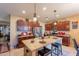 Modern kitchen with granite countertops and dark wood cabinets at 16140 W Almeria Rd, Goodyear, AZ 85395