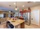 Spacious kitchen with granite countertops, stainless steel appliances, and ample cabinetry at 16140 W Almeria Rd, Goodyear, AZ 85395