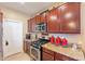 Modern kitchen with stainless steel appliances and granite countertops at 16140 W Almeria Rd, Goodyear, AZ 85395