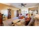 Living room with a sofa, chairs, and decorative accents at 16140 W Almeria Rd, Goodyear, AZ 85395