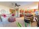 Open concept living room and kitchen with lots of natural light at 16140 W Almeria Rd, Goodyear, AZ 85395