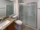 Bathroom with granite vanity and a large walk-in shower at 16530 N 114Th Dr, Surprise, AZ 85378
