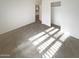Bright bedroom featuring tile floors and a spacious closet at 16530 N 114Th Dr, Surprise, AZ 85378