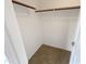 Large walk-in closet with wood shelving at 16530 N 114Th Dr, Surprise, AZ 85378
