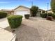 Single-story house with a two-car garage and well-maintained landscaping at 16530 N 114Th Dr, Surprise, AZ 85378