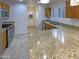 Kitchen boasts granite countertops, stainless steel appliances, and ample cabinet space at 16530 N 114Th Dr, Surprise, AZ 85378