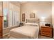 Cozy bedroom with a double bed and wood nightstand at 22719 N 93Rd St, Scottsdale, AZ 85255