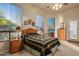 Cozy bedroom with a twin bed, dresser, and window seat at 22719 N 93Rd St, Scottsdale, AZ 85255