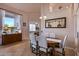Elegant dining room with a large table and view to living room at 22719 N 93Rd St, Scottsdale, AZ 85255