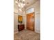 Inviting entryway with wood door, mirror, and decorative rug at 22719 N 93Rd St, Scottsdale, AZ 85255