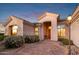 Welcoming entryway with a wood door and brick pavers at 22719 N 93Rd St, Scottsdale, AZ 85255
