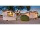 Single story home with a manicured yard and a welcoming entryway at 22719 N 93Rd St, Scottsdale, AZ 85255