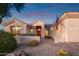 Beautiful stucco home with a welcoming front porch and desert landscaping at 22719 N 93Rd St, Scottsdale, AZ 85255