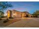 Single story home with a two car garage, and desert landscaping at 22719 N 93Rd St, Scottsdale, AZ 85255