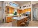 Spacious kitchen with large island, wood cabinets, and stainless steel appliances at 22719 N 93Rd St, Scottsdale, AZ 85255