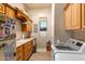 Laundry room with washer, dryer, and ample storage at 22719 N 93Rd St, Scottsdale, AZ 85255