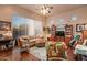 Spacious living room featuring hardwood floors, comfortable seating, and built-in shelving at 22719 N 93Rd St, Scottsdale, AZ 85255