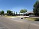 Home with a long driveway and a large green lawn at 22834 E Mccowan Ct, Queen Creek, AZ 85142