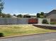 Landscaped front yard with a wooden gate and block wall at 22834 E Mccowan Ct, Queen Creek, AZ 85142