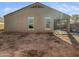 Unlandscaped backyard with a covered patio at 41096 W Jenna Ln, Maricopa, AZ 85138