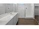 Modern bathroom with a large shower and double vanity at 41096 W Jenna Ln, Maricopa, AZ 85138