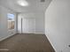 Simple bedroom with neutral walls and carpet flooring at 41096 W Jenna Ln, Maricopa, AZ 85138