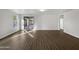 Spacious living room with tile flooring and sliding glass doors at 41096 W Jenna Ln, Maricopa, AZ 85138