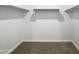 Large walk-in closet with double hanging rods and shelving at 41096 W Jenna Ln, Maricopa, AZ 85138