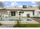 Stunning pool and patio area with lounge chairs and umbrellas at 4115 W Lawrence Ln, Phoenix, AZ 85051