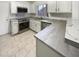 Modern kitchen with stainless steel appliances and white cabinets at 4338 E Desert Trumpet Rd, Phoenix, AZ 85044