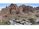 Aerial view of homes in a community surrounded by a mountain at 5761 N Echo Canyon Cir, Phoenix, AZ 85018