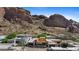 Aerial view of home under construction nestled within a community and mountains at 5761 N Echo Canyon Cir, Phoenix, AZ 85018