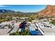 Aerial view of community, showcasing architectural styles and mountain backdrop at 5761 N Echo Canyon Cir, Phoenix, AZ 85018