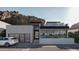 Contemporary home exterior boasts clean lines, modern design, glass garage door, and mountain views at 5761 N Echo Canyon Cir, Phoenix, AZ 85018
