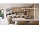 Open concept kitchen showcasing wood cabinets, an island with seating, and a dining area at 5761 N Echo Canyon Cir, Phoenix, AZ 85018