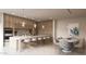 Luxurious kitchen features wood cabinets, marble countertops, an island with seating, and a dining area at 5761 N Echo Canyon Cir, Phoenix, AZ 85018