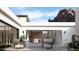 Outdoor patio with seating area, a fire pit, and views of the surrounding mountains at 5761 N Echo Canyon Cir, Phoenix, AZ 85018