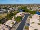 Community view showcasing home near lake at 6413 W Irma Ln, Glendale, AZ 85308