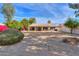 Large backyard with gravel and desert landscaping at 6413 W Irma Ln, Glendale, AZ 85308