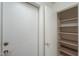 Shelved hall closet with ample storage space at 6413 W Irma Ln, Glendale, AZ 85308