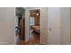 Hallway with wood flooring and access to bedrooms at 6413 W Irma Ln, Glendale, AZ 85308