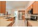 Kitchen with stainless steel appliances and wood cabinets at 6413 W Irma Ln, Glendale, AZ 85308