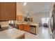 Open concept kitchen with stainless steel appliances at 6413 W Irma Ln, Glendale, AZ 85308