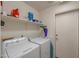 Laundry room with washer, dryer, and shelving at 6413 W Irma Ln, Glendale, AZ 85308