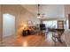 Living room with hardwood floors, leather couch, and rocking chair at 6413 W Irma Ln, Glendale, AZ 85308