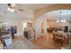 Living room with wood floors and access to the kitchen at 6413 W Irma Ln, Glendale, AZ 85308