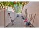 Side yard with storage and gardening tools at 6413 W Irma Ln, Glendale, AZ 85308