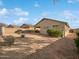 Landscaped backyard with gravel and a covered patio area at 6546 E Casa De Risco Ln, Gold Canyon, AZ 85118