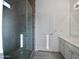 Updated bathroom with a glass shower, double vanity, and modern fixtures at 6546 E Casa De Risco Ln, Gold Canyon, AZ 85118